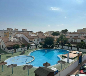 Family apartment with pool in Oliva Nova